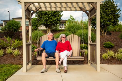 couple on swing outdoors 